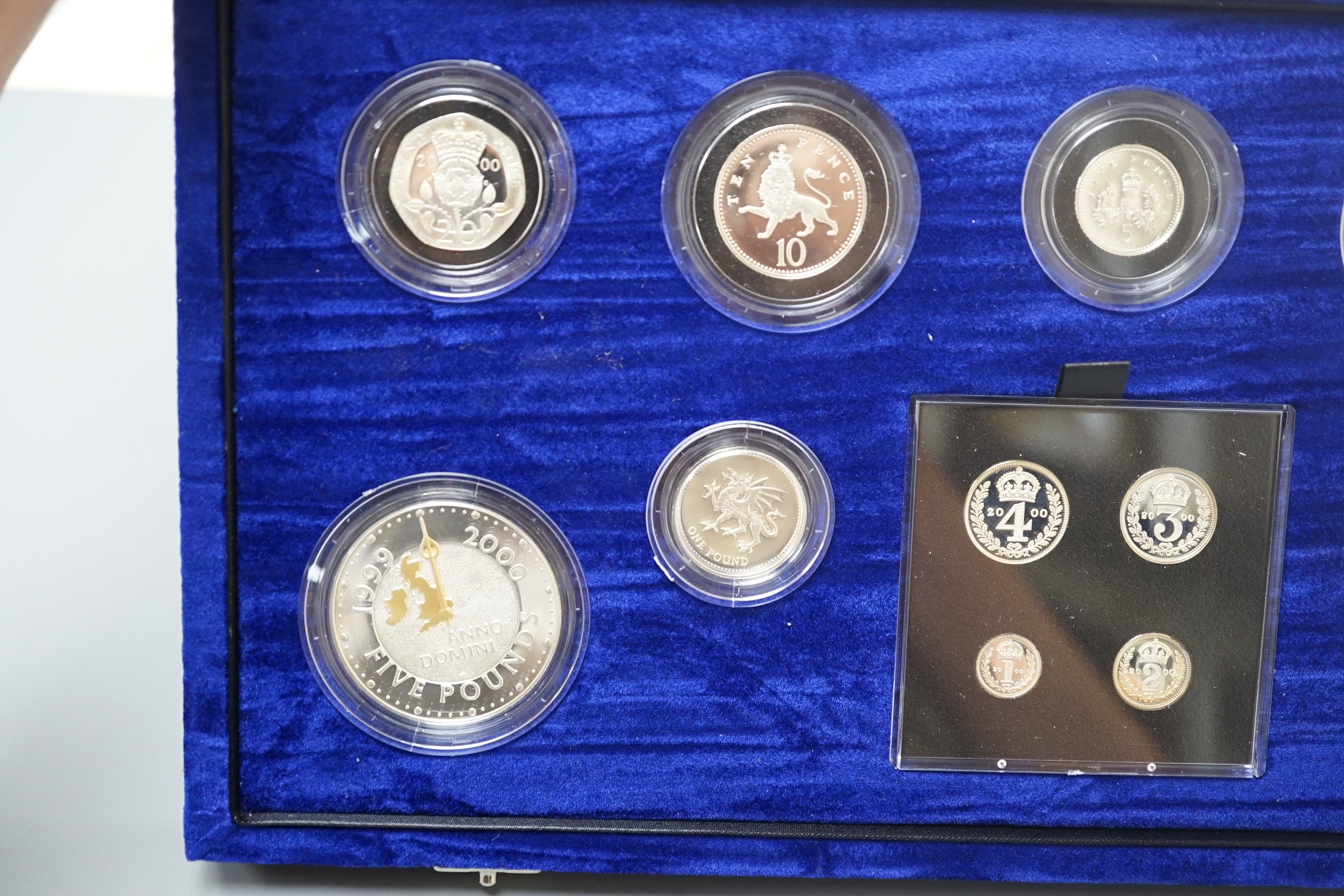 A cased Royal Mint UK Millennium silver proof coin collection 2000, including a maundy set
